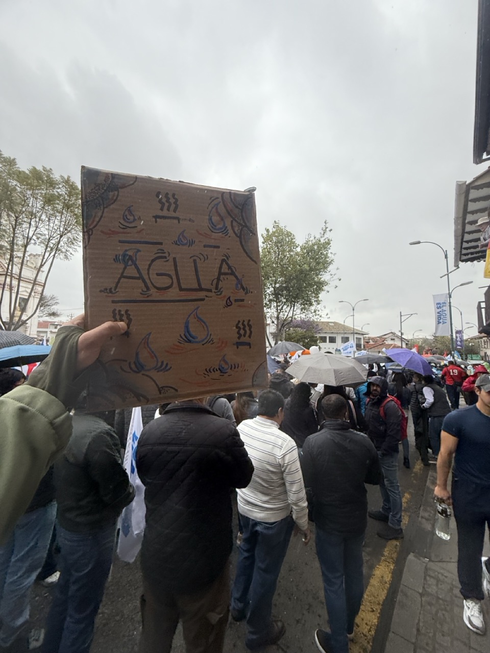 Participants carrying banners supporting water rights
